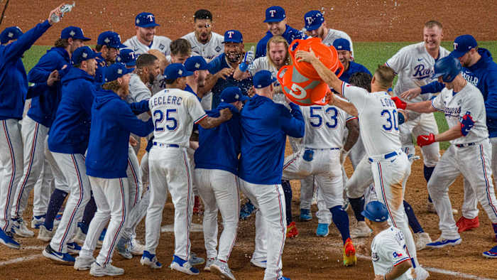 The Texas Rangers celebrate their Game 1 World Series win.
